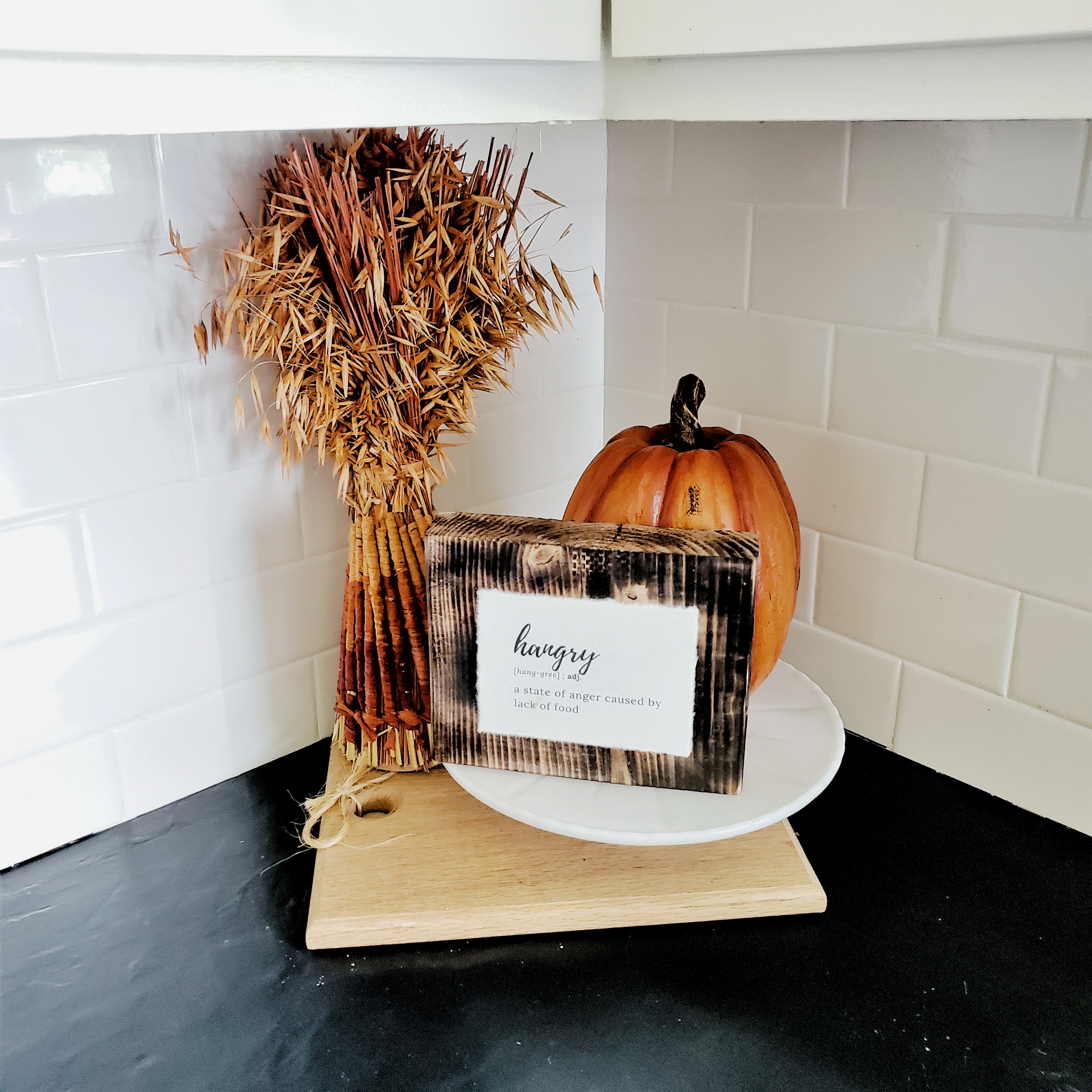 Hangry - the perfect sign for your kitchen.  Add a pumpkin and some seasonal grass on layered trays and containers for the perfect display.