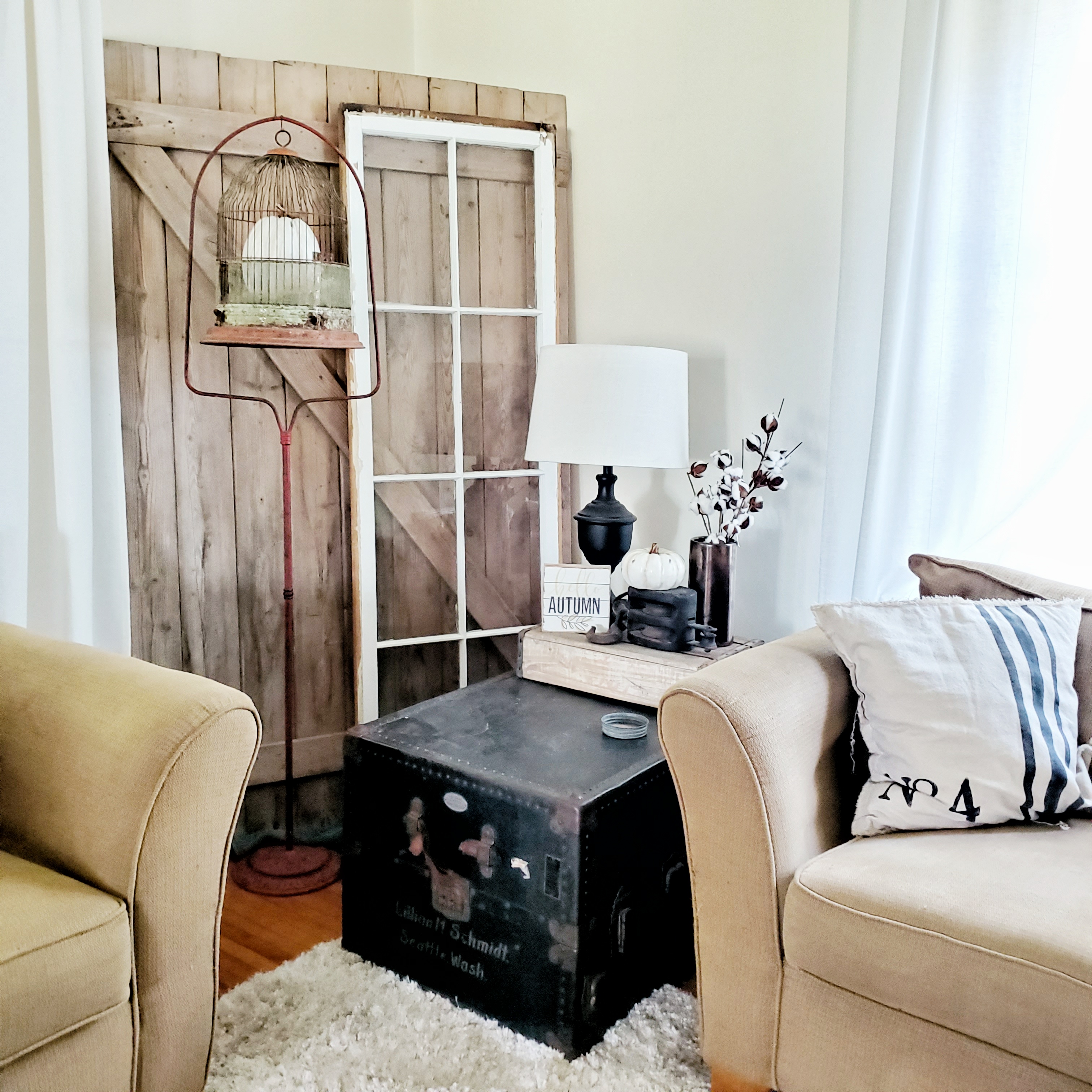 Use a trunk as a side table, layered with a crate and accessories.