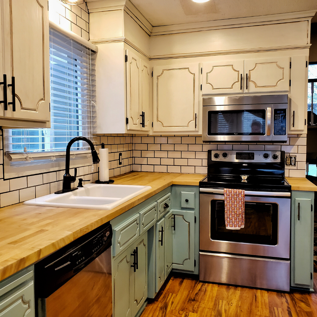 Update your RV with a modern farmhouse look with gray painted cabinets, curtains, a new wood stained table, and updated countertops for less than $500!