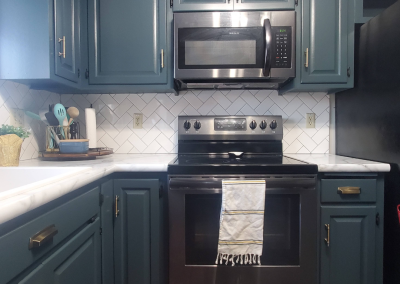 Cabinetry Painting + Herringbone Subway Tile Backsplash | Buffalo Lake, Minnesota