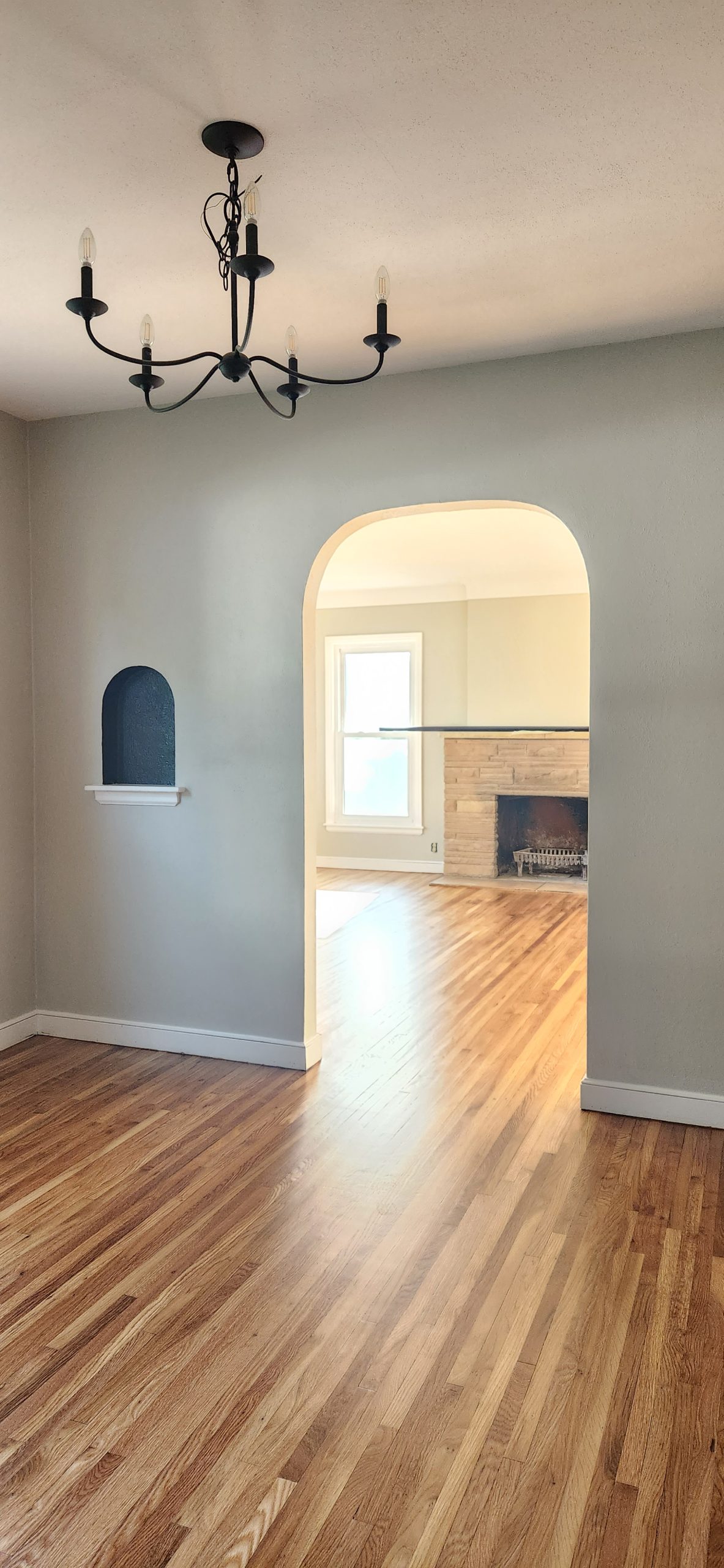 Black and white farmhouse style mudroom remodel with luxury vinyl tile flooring.