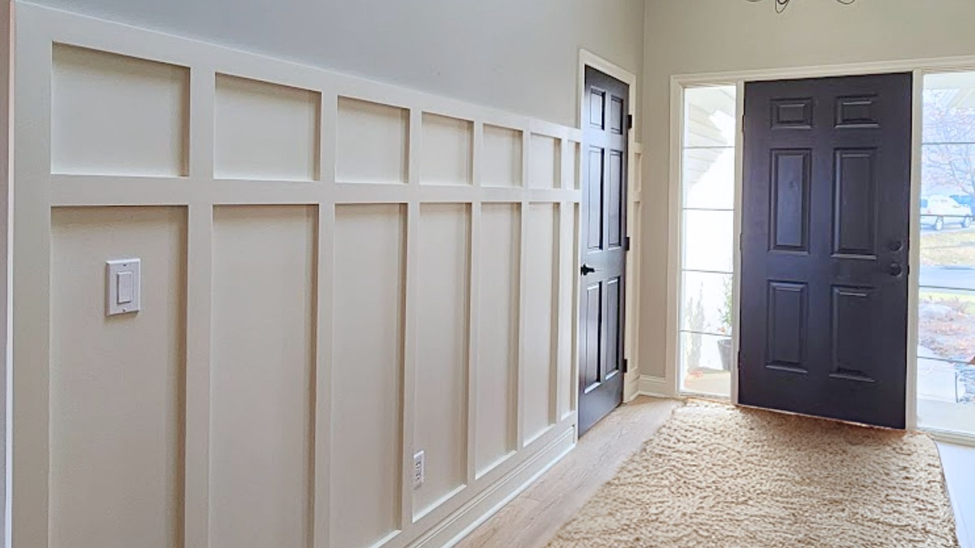 Modern accent wall with board and batten installed by MeshedDesigns in a Minnesota living room.<br />
