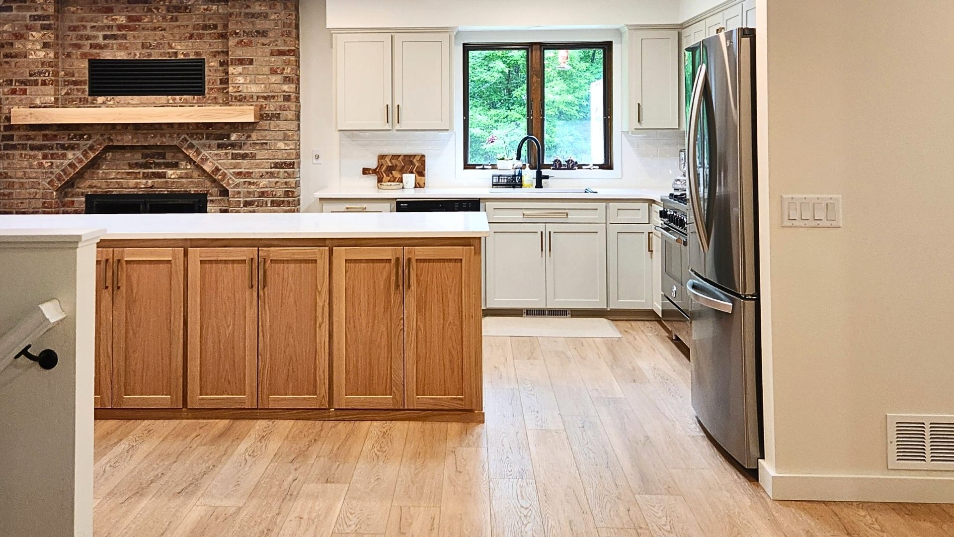 Custom wood cabinetry installed in a modern Minnesota kitchen by MeshedDesigns.
