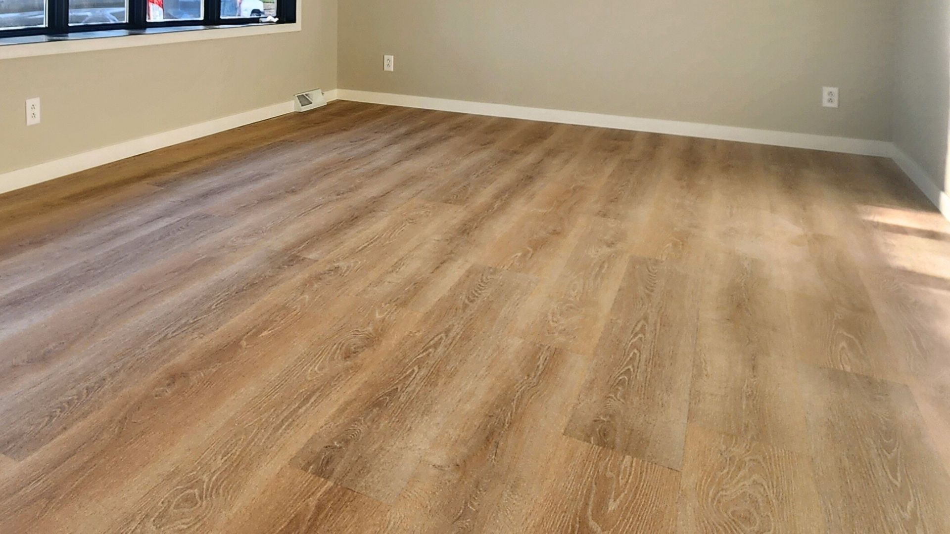 Luxury vinyl plank flooring installation during a Minnesota home renovation by MeshedDesigns.<br />
