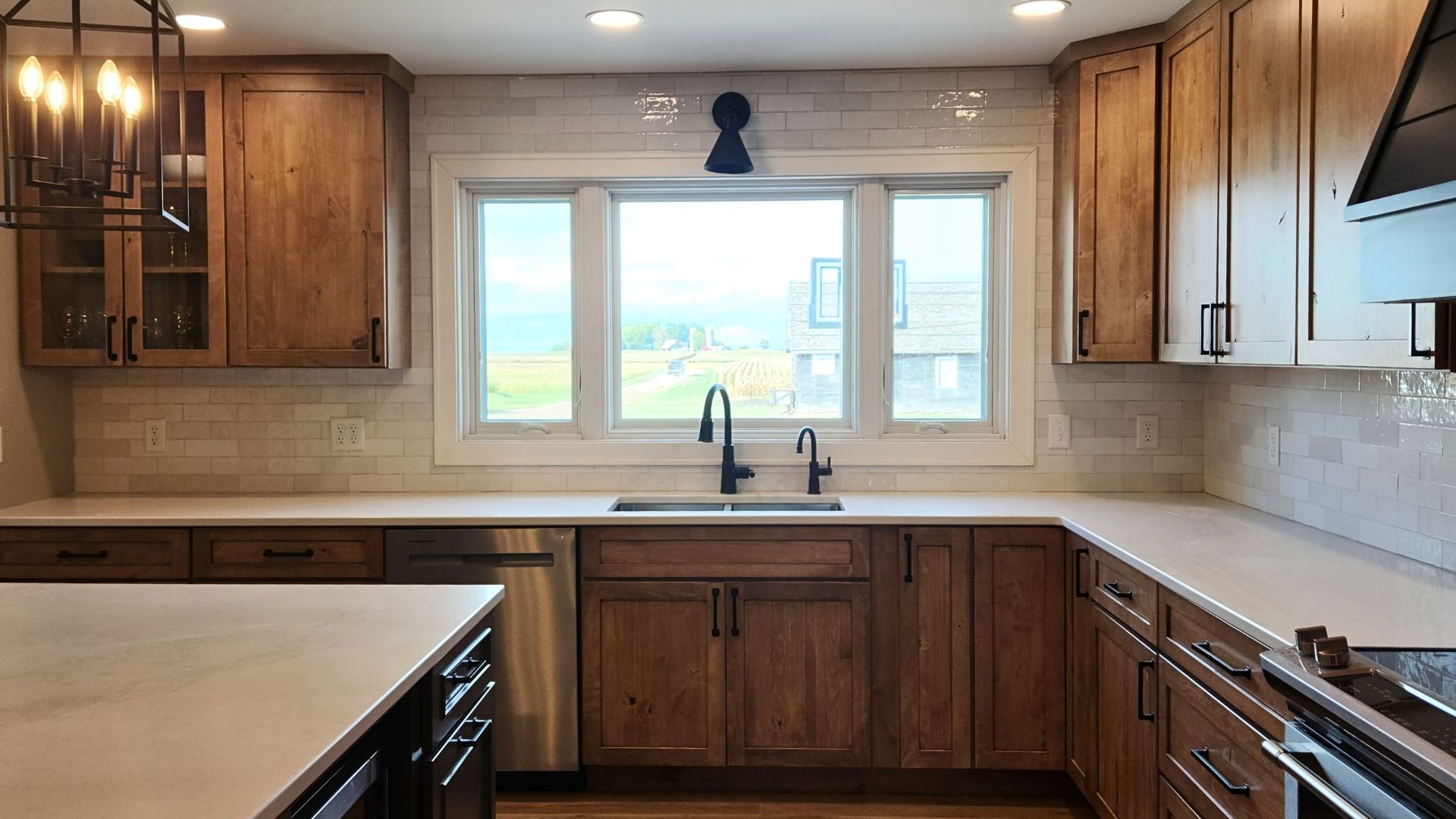 White quartz countertops installed in a Minnesota kitchen renovation by MeshedDesigns.<br />
