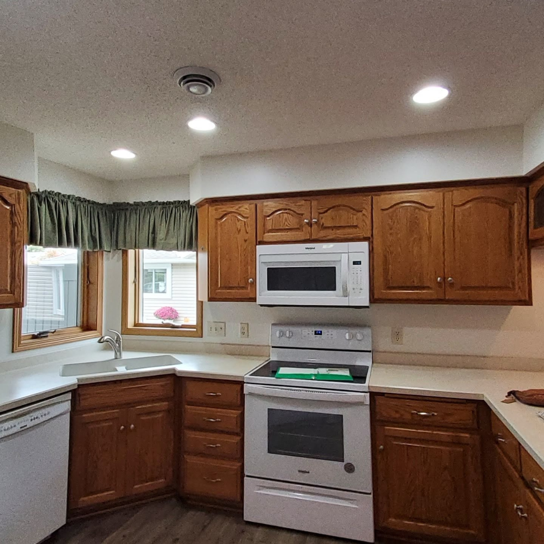 This kitchen had the dated golden oak + white appliance look and the client was ready for a beautiful change. 