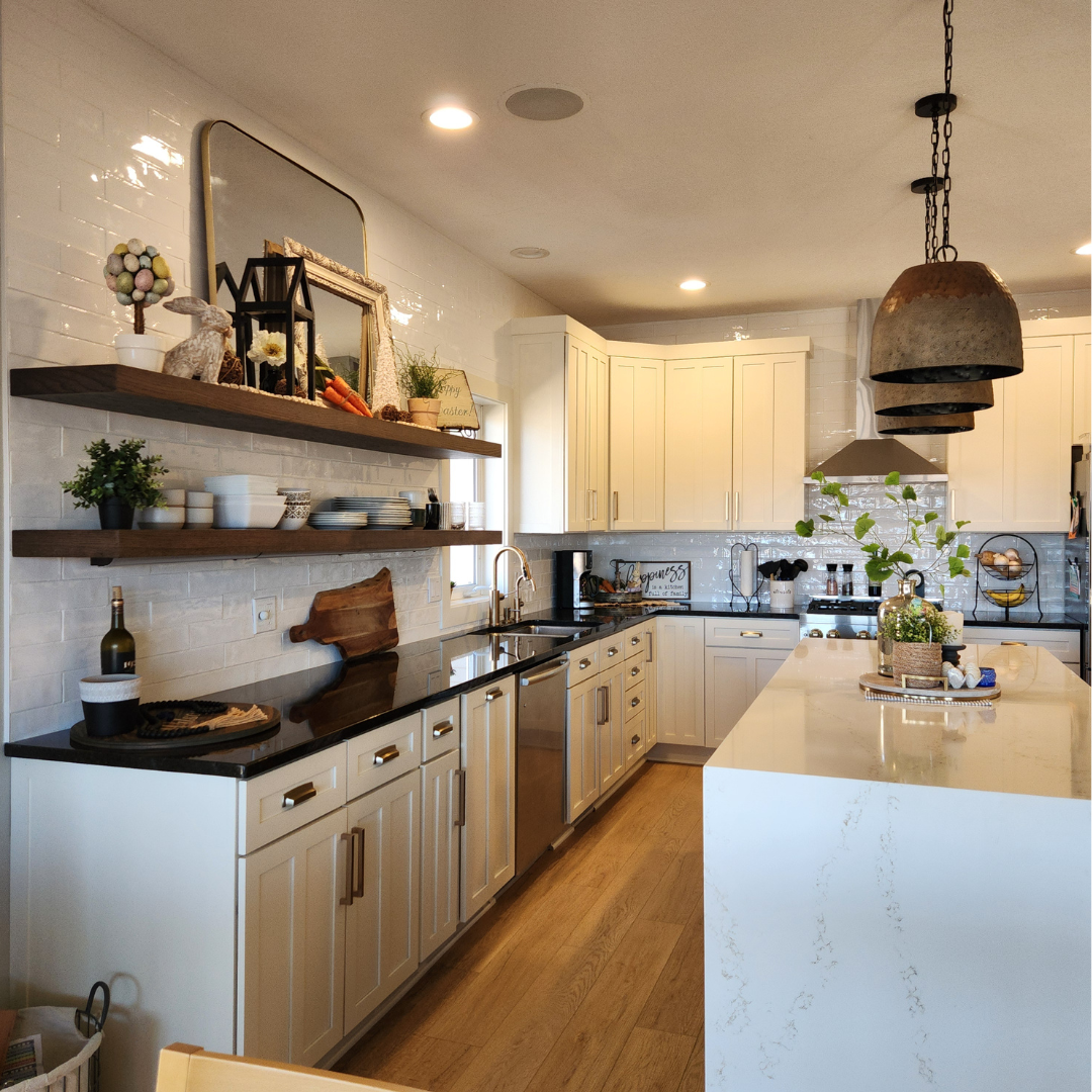 This kitchen is magazine worthy.  Featuring beautiful finishes, some open shelving for visual interest, unique lighting and completely new layout.  