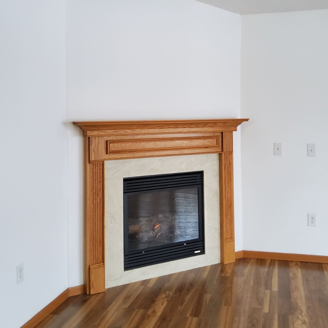 This fireplace is functional but in need of a refresh especially to be cohesive with the rest of the updates happening in the home.  Currently, the surround has more of a mosaic tile look. 
