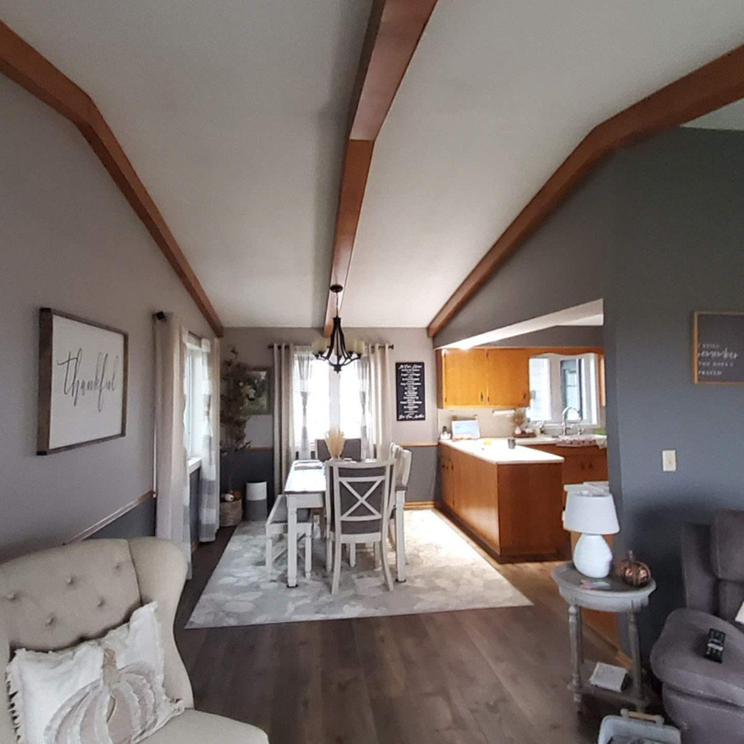 This picture highlights a kitchen ready for a new layout and refresh. It presents a little dark, and could use brightening. There is a peninsula that makes an L that could be changed. 