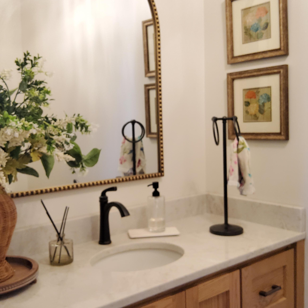 This picture highlights a kitchen ready for a new layout and refresh. It presents a little dark, and could use brightening. There is a peninsula that makes an L that could be changed. 