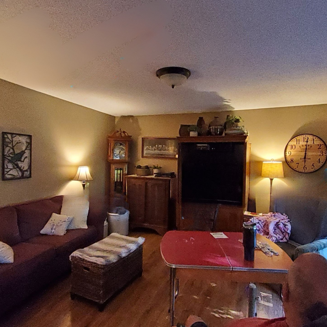 This picture highlights a kitchen ready for a new layout and refresh. It presents a little dark, and could use brightening. There is a peninsula that makes an L that could be changed. 